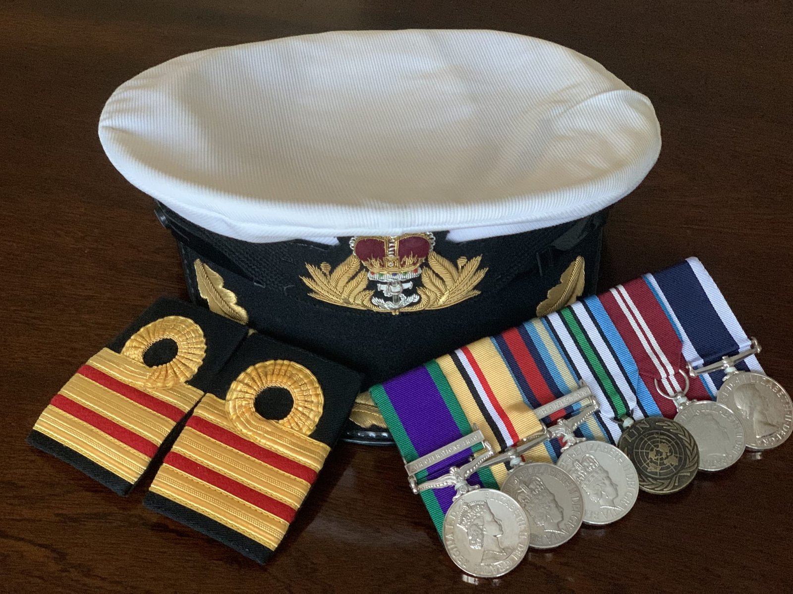 Commander's cap, shoulder boards and medal rack