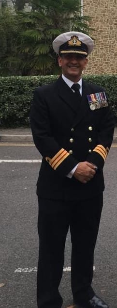 Professor Khan in Royal Navy No.1 dress with medals